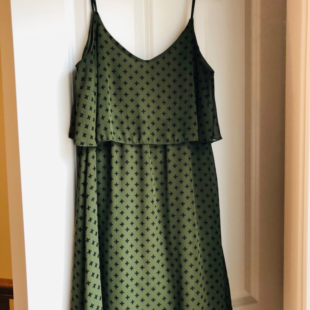 Green with small black print midi length dress
